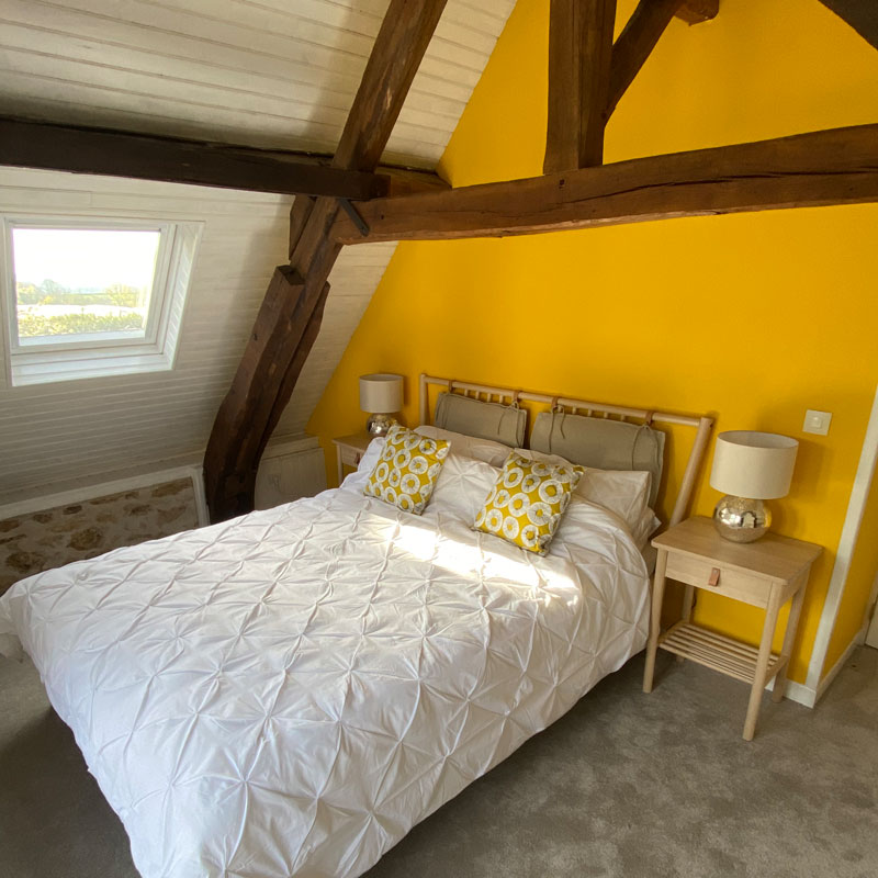 Gite bedroom with wooden beams
