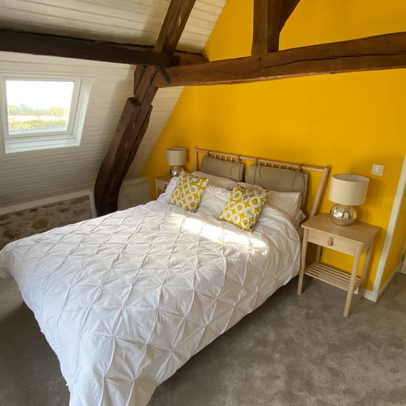 Gite bedroom with wooden beams