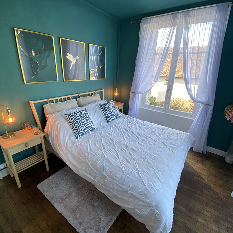 Framed artwork above bed